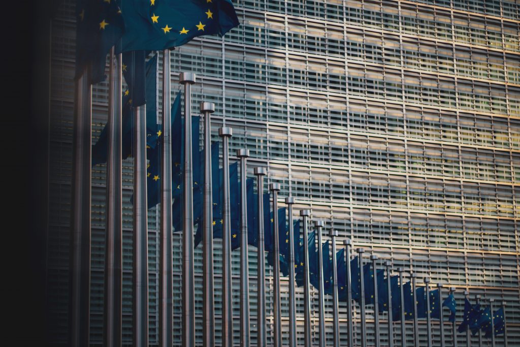 Flags of the European Union in front of the EU-commission building "Berlaymont" in Brussels, Belgium