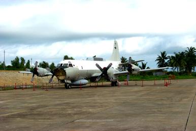 The EP-3 awaits fuel removal and disassembly at the prepared worksite at Lingshui Airfield June 18. U.S. Pacific Command began operations June 13 to return the damaged U.S. Navy EP-3 surveillance plane to the United States. (Photos courtesy of Lockheed Martin Aeronautics Co.)