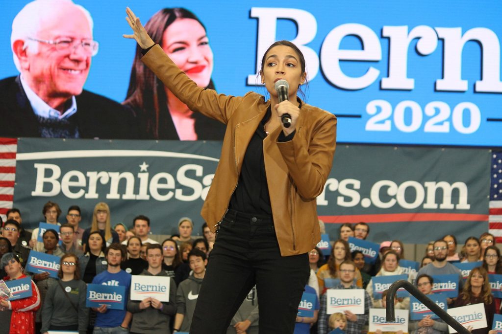 Rep. Alexandria Ocasio-Cortez speaking to attendees at a rally for Bernie Sanders in Council Bluffs, Iowa in 2019 (Photo: Matt A. Johnson / Wikimedia Commons)