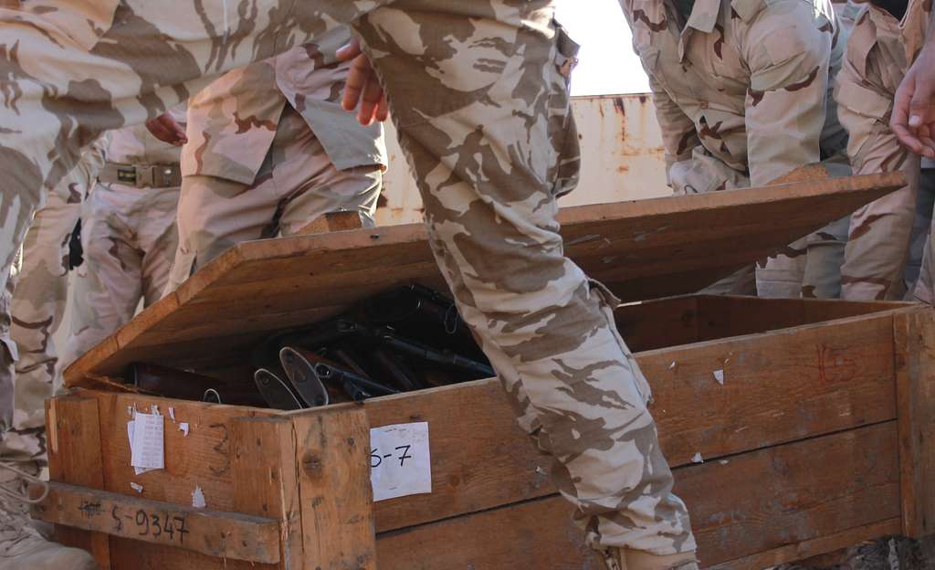 Soldiers from the Iraqi Security Forces unload a shipment of over 1,000 AK-47’s that were donated from coalition partners to assist in their fight against ISIL in 2015 (Photo: Defense Visual Information Distribution Service)