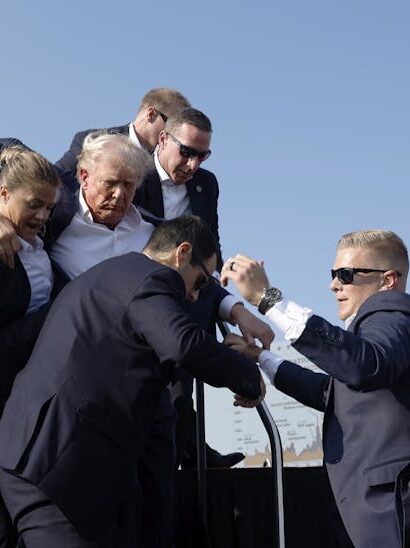 U.S. Secret Service agents help former President Donald Trump offstage during a rally on July 13, 2024, in Butler, Pa. (Photo: Anna Moneymaker / Getty Images)