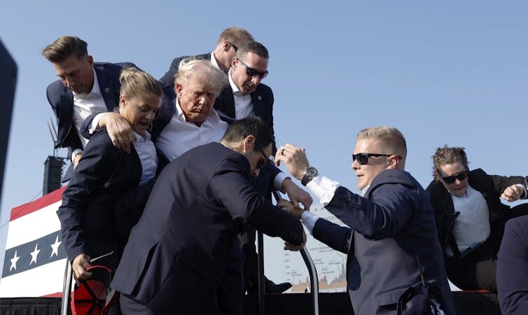 U.S. Secret Service agents help former President Donald Trump offstage during a rally on July 13, 2024, in Butler, Pa. (Photo: Anna Moneymaker / Getty Images)