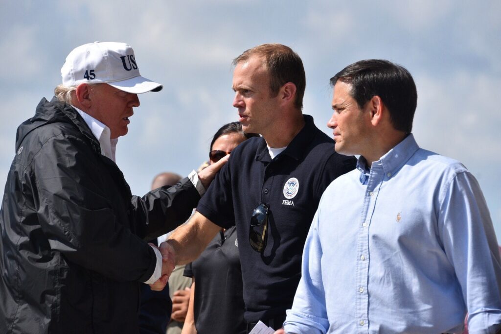 President Donald Trump greets FEMA Administrator Brock Long and Sen. Marco Rubio shortly after arriving in Ft. Meyers, Fla., Sept. 14, 2017 (Photo: U.S. Coast Guard)