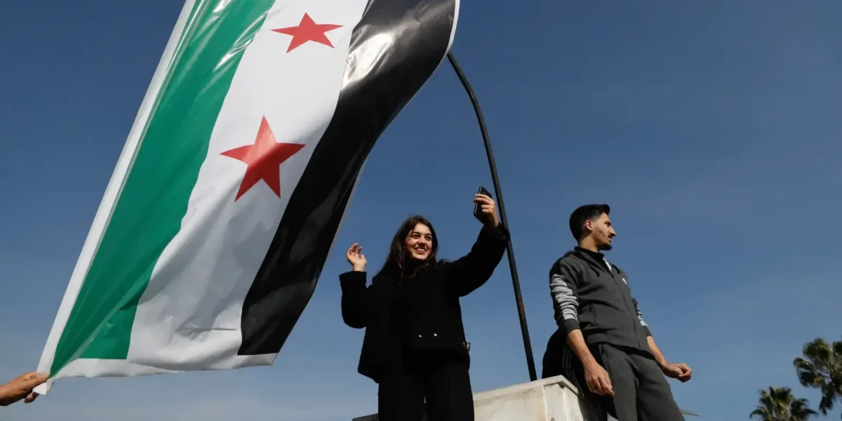 Syrians celebrate the downfall of President Bashar al-Assad near the Umayyad Mosque in Aleppo on Monday (Photo: AP / Free Malaysia Today)