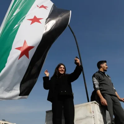 Syrians celebrate the downfall of President Bashar al-Assad near the Umayyad Mosque in Aleppo on Monday (Photo: AP / Free Malaysia Today)