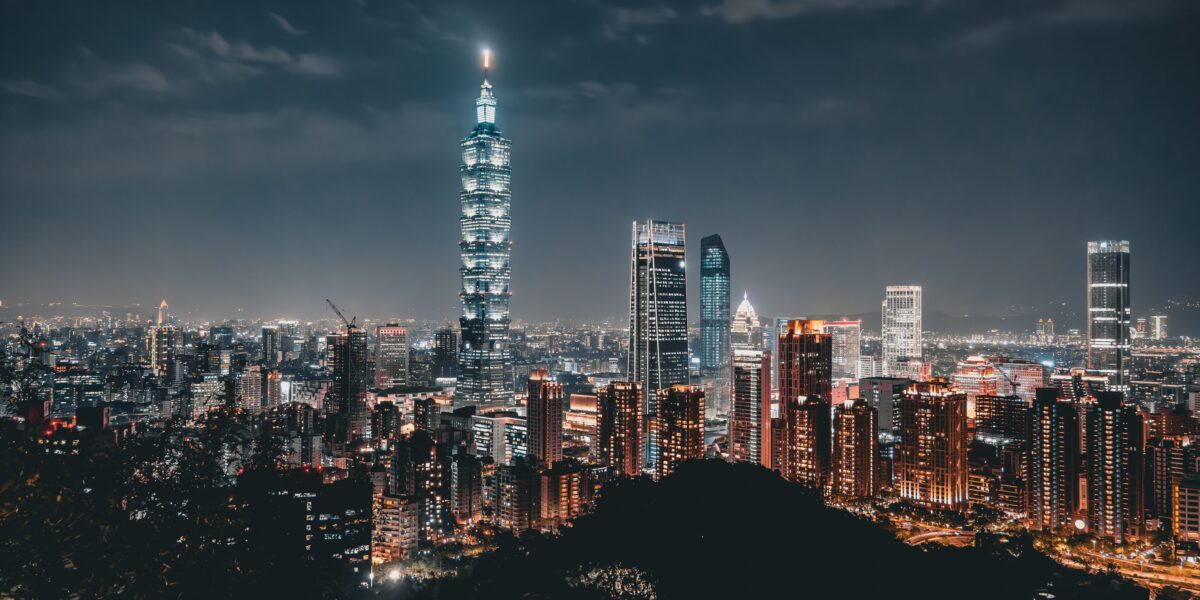 Night view of the Taipei skyline featuring the illuminated Taipei 101 amid modern skyscrapers. Photo source: Ehsan Haque / Pexels.