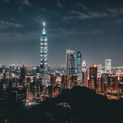 Night view of the Taipei skyline featuring the illuminated Taipei 101 amid modern skyscrapers. Photo source: Ehsan Haque / Pexels.