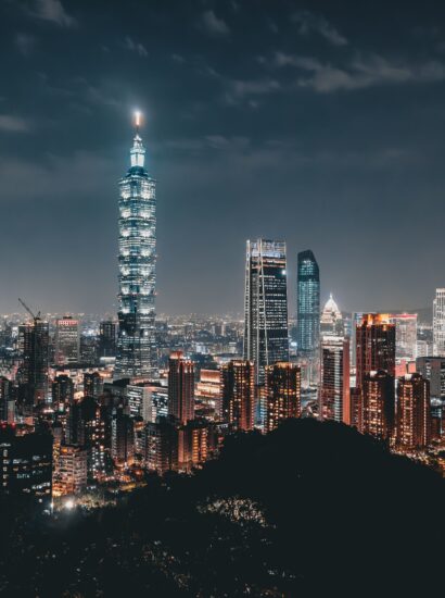 Night view of the Taipei skyline featuring the illuminated Taipei 101 amid modern skyscrapers. Photo source: Ehsan Haque / Pexels.