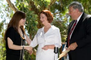Julia Gillard, the first female Australian Prime Minister, and Department of Immigration and Citizenship Secretary Mr. Andrew Metcalfe hand out Citizenship Certificates to new Australian Citizens, 2011. Photo source: Australia Day Citizenship Ceremony 2011 / DIAC images / Wikimedia Commons, CC BY 2.0.
