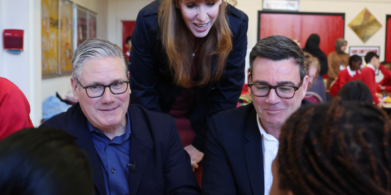 Manchester, United Kingdom. Prime Minister Keir Starmer visits Holy Trinity Church of England Primary School with Andy Burnham, Mayor of Greater Manchester, 13 April 2026. Photo source: Lauren Hurley / No. 10 Downing Street / Wikimedia Commons (Open Government Licence v3.0).