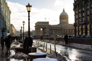 A winter scene near Kazan Cathedral with snow and pedestrians on a city street in Saint Petersburg. Source: Vitali Adutskevich / Pexels.