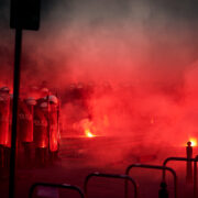 france, Police,Cordon,And,Red,Flares,During,Street,Protest